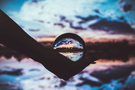 Crystal ball and a fantastic backgroundの写真素材