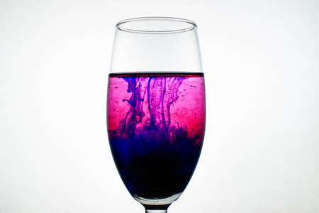 wallpaper of ink in glassの写真素材