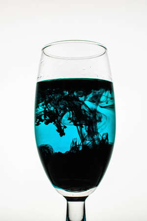 a fantastic wallpaper of ink in glassの写真素材