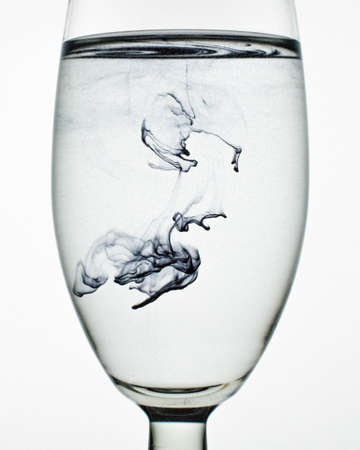 a fantastic wallpaper of ink in glassの写真素材