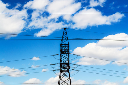 power line against the blue bright skyの写真素材