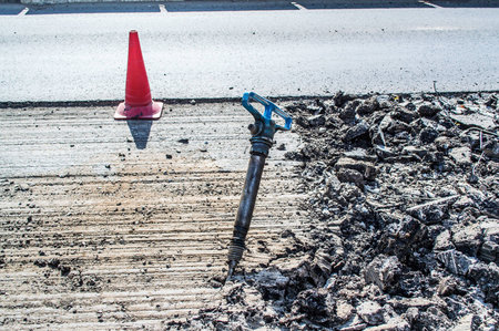 a jackhammer in the middle of the road