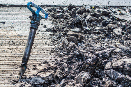 a jackhammer in the middle of the roadの写真素材