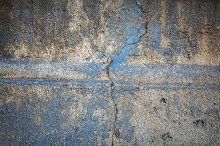 the surface of the old cracked concrete wallの写真素材