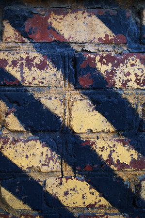 brick wall painted with colored inks