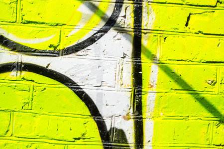 Brick wall with bright graffityの写真素材