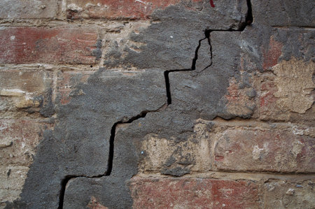 texture of wall from an old red brick with crack