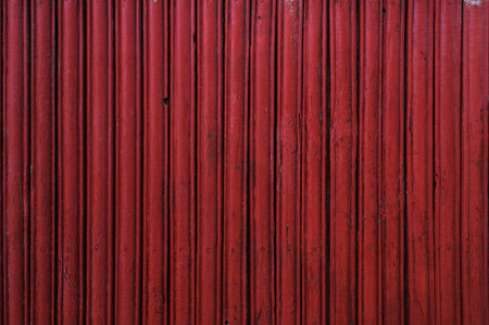 Texture of old wooden fence painted in redの写真素材
