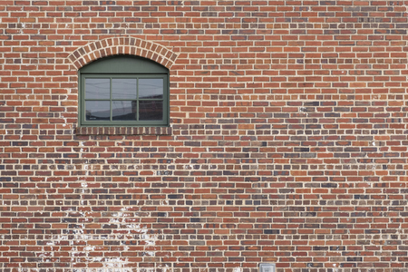 brick wall with window door old aged brick decorative viewの写真素材