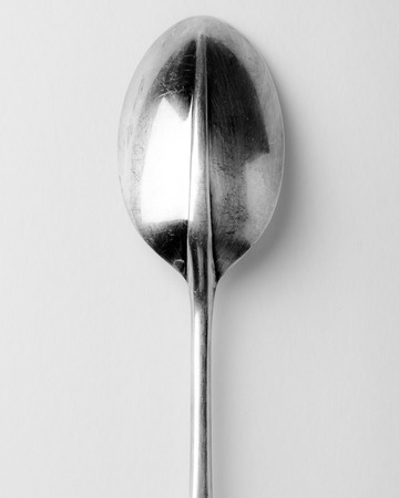 vintage silver serving spoon Kitchen Utensil on white background utensilsの写真素材