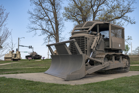 Rome Plow D7E cleared lands in Vietnam capable of splitting trees. An outdoor military vehicle complex featuring vehicles used throughout military history eras.のeditorial素材