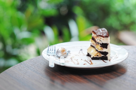 Little pice of chocolate cake with bananaの写真素材