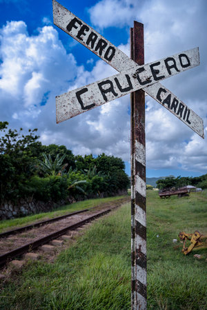 Old railroad crossing sign in trinidad, cuba, tropical caribbean countrysideの写真素材