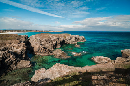 Las catedrales beach exploring rugged cliffs and clear turquoise oceanの写真素材