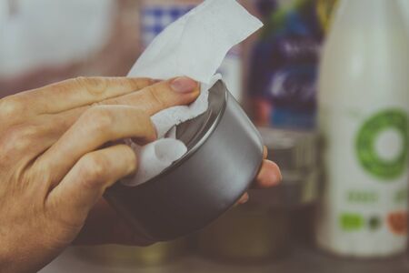 Home sanitization of groceries purchased in a supermarket during the coronavirus pandemic. Washing products at home after purchase.の写真素材