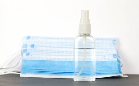 Coronavirus hand sanitizer for hand hygiene and prevention medical surgical masks for corona virus protection on the white background.の写真素材