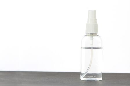 Coronavirus hand sanitizer spray for hand hygiene for corona virus protection on the table on white background.の写真素材