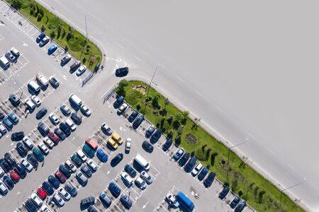 Pattern for design with space for text: car parking. Lots of multi-colored cars in parking lots. Shooting from a drone.の写真素材