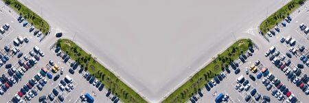 Pattern for design with space for text: car parking. Lots of multi-colored cars in parking lots. Shooting from a drone.の写真素材