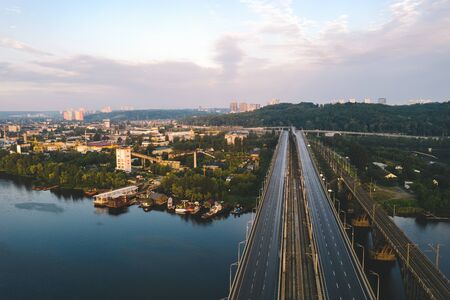 A bridge with a road through the River Dnipro near the industrial production quarter in Kiev.の写真素材