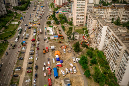 Kyiv, Ukraine - 21.06.2020: The emergency operations headquarters works at the site of a gas explosion in the building in Kyiv. Special equipment dismantles the rubble of the concrete floorsのeditorial素材