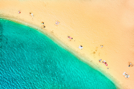 Aerial Top Drone view of a people on the Sand beach. Vacation sea Background. Azure Beach River...