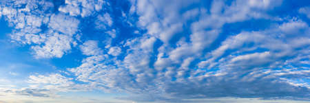Magnificent magical panorama of blue skies at day with white cloudsの写真素材