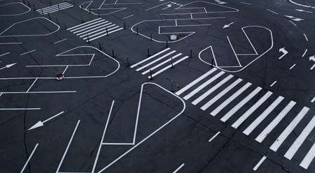 White road markings for traffic in the parking lotの写真素材