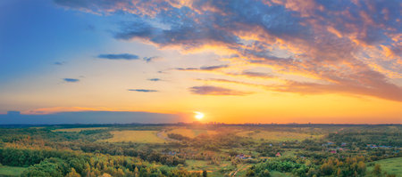 Beautiful autumn rural landscape in the country on the sunsetの写真素材