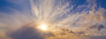 Beautiful winter sunset with lights of a sunの写真素材