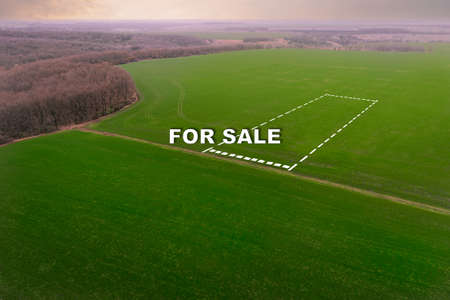 Plot of farm field with crops for sale - aerial top view with text For Saleの写真素材