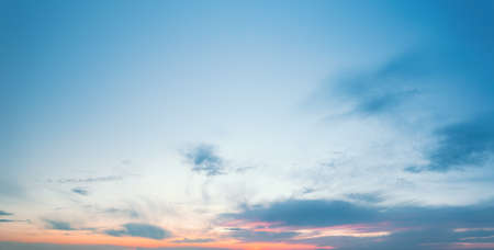 Sunset blue sky pattern with cimbling cloudsの写真素材
