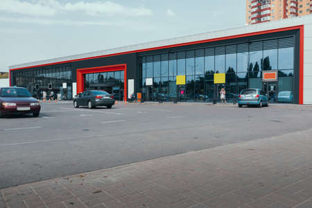 Supermarket outside with car parking and glass showcaseの写真素材