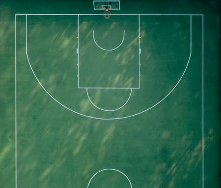 Half Sports basketball playground with green grassの写真素材