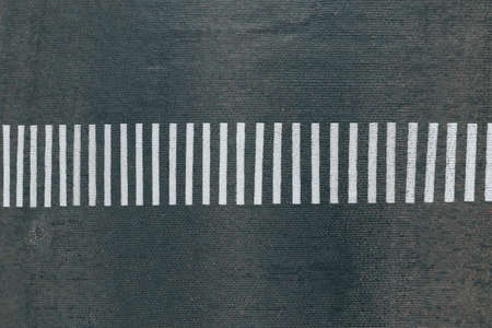 Empty Pedestrian crossing on the road of paving stones, top viewの写真素材