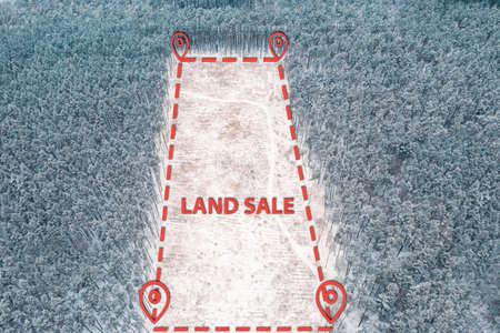 Topographic GPS plot of land for Sale in winter forest with Land Sale sighの写真素材