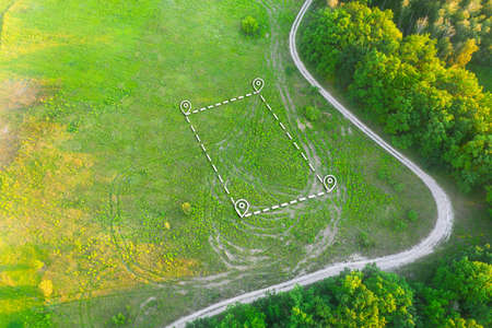 Topographical Marking of Land plot on Green Field for House Constructionの写真素材