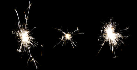 Set of 3 Fire Sparklers isolated on black backgroundの写真素材
