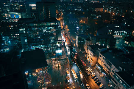 Traffic on Nezalezhnosti avenue near the hotel Kharkiv at night time: aerial drone viewのeditorial素材