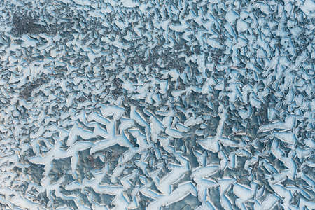 Dried and cracked surface of the river bottom - drought textureの写真素材