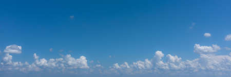 Panoramic banner with blue sky and cumulus cloudsの写真素材