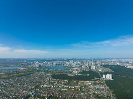 Big city in the distance against background of suburbs: high-rise multi-storey modern housesの写真素材
