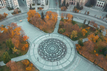 Square near Derzhprom in Kharkiv in autumn with yellow trees - aerial drone shotの写真素材