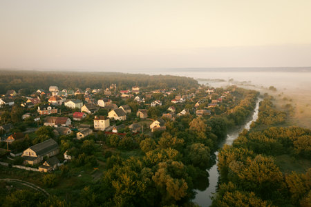 Residential private houses on the banks of the river - aerial drone shotの写真素材