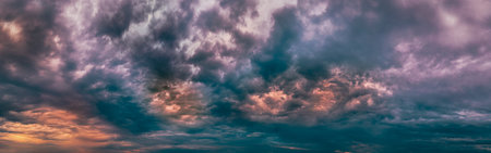 Epic smoky fiery clouds - wide panoramaの写真素材