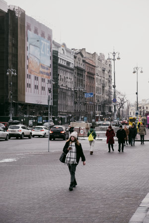Girl walks along Khreshchatyk in the center of Kyiv on a winter day without snowのeditorial素材