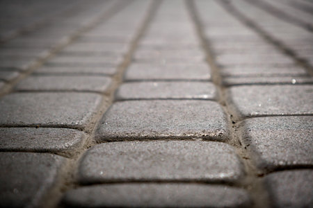 Gray stone clinker paving slabs - surface low angle shoot. Stone tile path.の写真素材