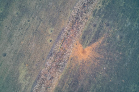 Aerial drone shot of a massive blast mark from a heavy FAB aerial bomb detonation next to defensive...