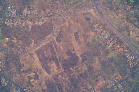 Aerial drone shot of a residential area turned into a ghost town by artillery shelling. Top down...
