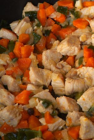 Homemade meat from turkey. Juicy, gentle slices, fried with young carrots. leek and fragrant pepper.の写真素材